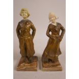 A pair of Art Deco style gilt bronze and ivory figurines, of a traditional Dutch boy and girl,