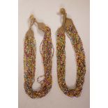Two Tibetan multistrand bugle bead necklaces, 24" long