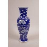 A C19th Chinese blue and white porcelain vase with prunus blossom decoration on a cracked ice