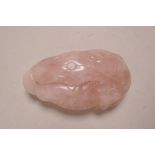 A Chinese rose quartz pendant with carved lotus flower and carp decoration, 2½" long