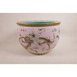 A Chinese polychrome porcelain jardiniere decorated with black and gilt dragons amongst white