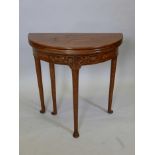 A Dutch colonial marquetry inlaid hardwood demi-lune three fold games table, A/F, 29" x 14½", 30" h