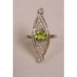 A 1920s yellow and white gold (untested) Art Deco ring set with diamonds and a central peridot,