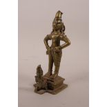 An Indian brass figure of a deity, 6½" high