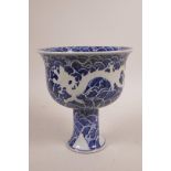 A Chinese blue and white stem bowl decorated with dragons, 6 character mark to base, 7" high x 6"