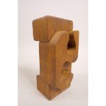 A mid C20th hardwood sculpture of abstract form, in the style of Brian Willsher (British, 1930-