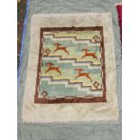 A Scandinavian mid century bespoke hand knotted wool rug decorated with a reindeer pattern, 56" x