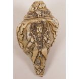 A conch shell with carved decoration of the Hindu deity Hanuman, 8" long