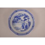 A Chinese blue and white porcelain dish decorated with figures and animals in a landscape, seal mark