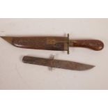 A sheath knife by W.M. Rodgers of Sheffield, 9" long, lacks sheath, together with an Indian knife