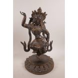 A Tibetan bronze figure of a dancer, stone set and with gilt highlights, 16" high