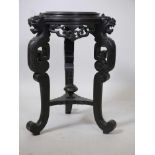 A late C19th/early C20th Chinese ebonised wood jardiniere stand, with pierced fret frieze, raised on