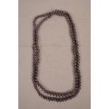 An opera length string of Tahitian black freshwater pearls, 45" long