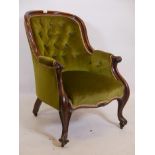 An early Victorian mahogany button back easy chair, on carved, scrolled feet, 35" high