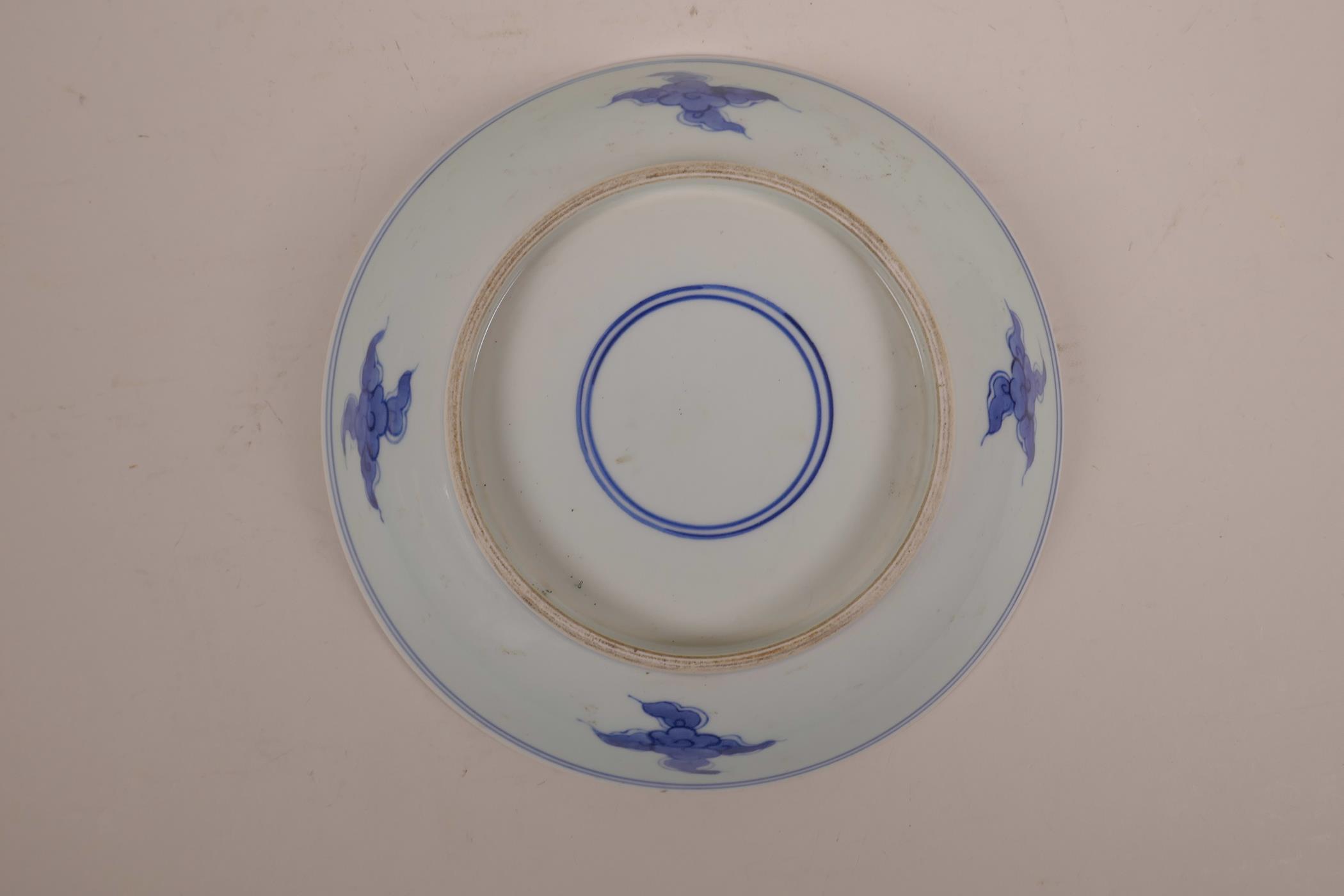 A Chinese blue and white porcelain dish decorated with a figure riding an ox, 8½" diameter - Image 3 of 3