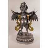 An Asian polished steel and brass figure of the bird deity Garuda, 20" high