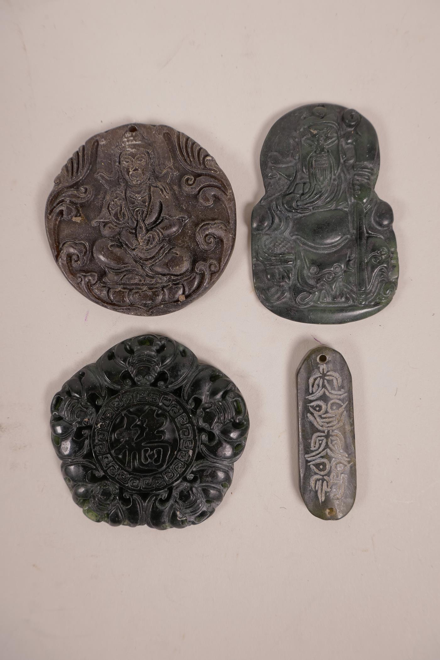 Four Chinese hardstone pendants with carved decoration of Immortals, bats and Chinese characters,