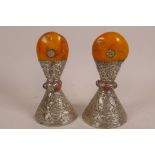 A pair of large Sino-Tibetan white metal conical seals with amber handles, 6½" high