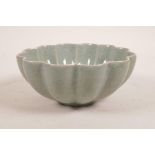 A Chinese celadon crackle glazed bowl with a petal shaped edge, incised character mark to base, 7"