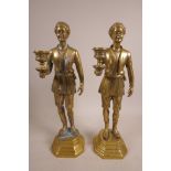 A pair of brass gentlemen candlesticks, 14" x 4", A/F