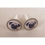 A pair of white metal cufflinks set with cold enamel plaques depicting a pug