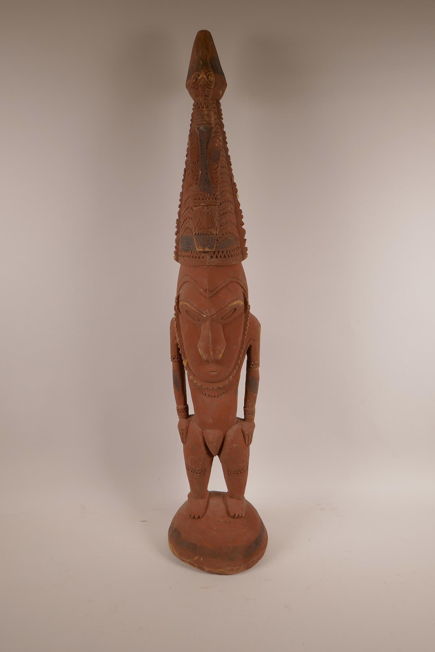 A carved wood New Guinea Sepik tribal figure,25" high