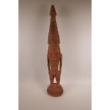 A carved wood New Guinea Sepik tribal figure,25" high