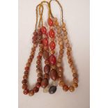Three strings of Oriental hardstone beads, longest 18"