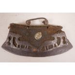 A Tibetan leather tinder purse decorated with pierced steel figures of animals, 6½" long