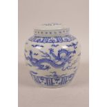 A Chinese blue and white porcelain ginger jar and cover decorated with two dragons in flight,