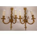 A pair of decorative gilt sconce wall lights, A/F, 17½" x 10"