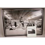 A large photographic print of Muhammad Ali at the Fighter's Heaven training camp in 1974, training