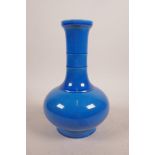 A Chinese blue glazed porcelain vase with a ribbed neck, 6 character mark to base, 8½" high