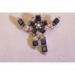 An Art Deco, white metal brooch set with ten sapphires and sixteen diamonds, unmarked, 11.1 grams