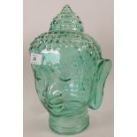 A green glass Buddha head, 12" high