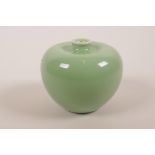A Chinese green glazed porcelain vase in the form of an apple, 3" high