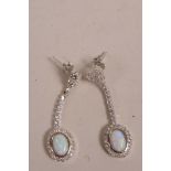 A pair of silver, cubic zirconium and opalite set drop earrings, 1" drop