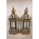 A pair of Moorish style hexagonal lanterns with pierced decoration, 24½" high