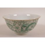 A Chinese porcelain rice bowl decorated with green enamel dragons, 6 character mark to base, 6"
