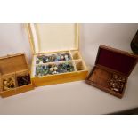 A box of vintage glass marbles together with a set of matched chess pieces and a table skittles game