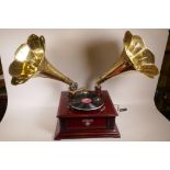 A reproduction twin horn gramophone, base unit 17½" x 17½"