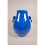 A Chinese blue glazed porcelain vase with two elephant mask handles, one A/F, decorated with a