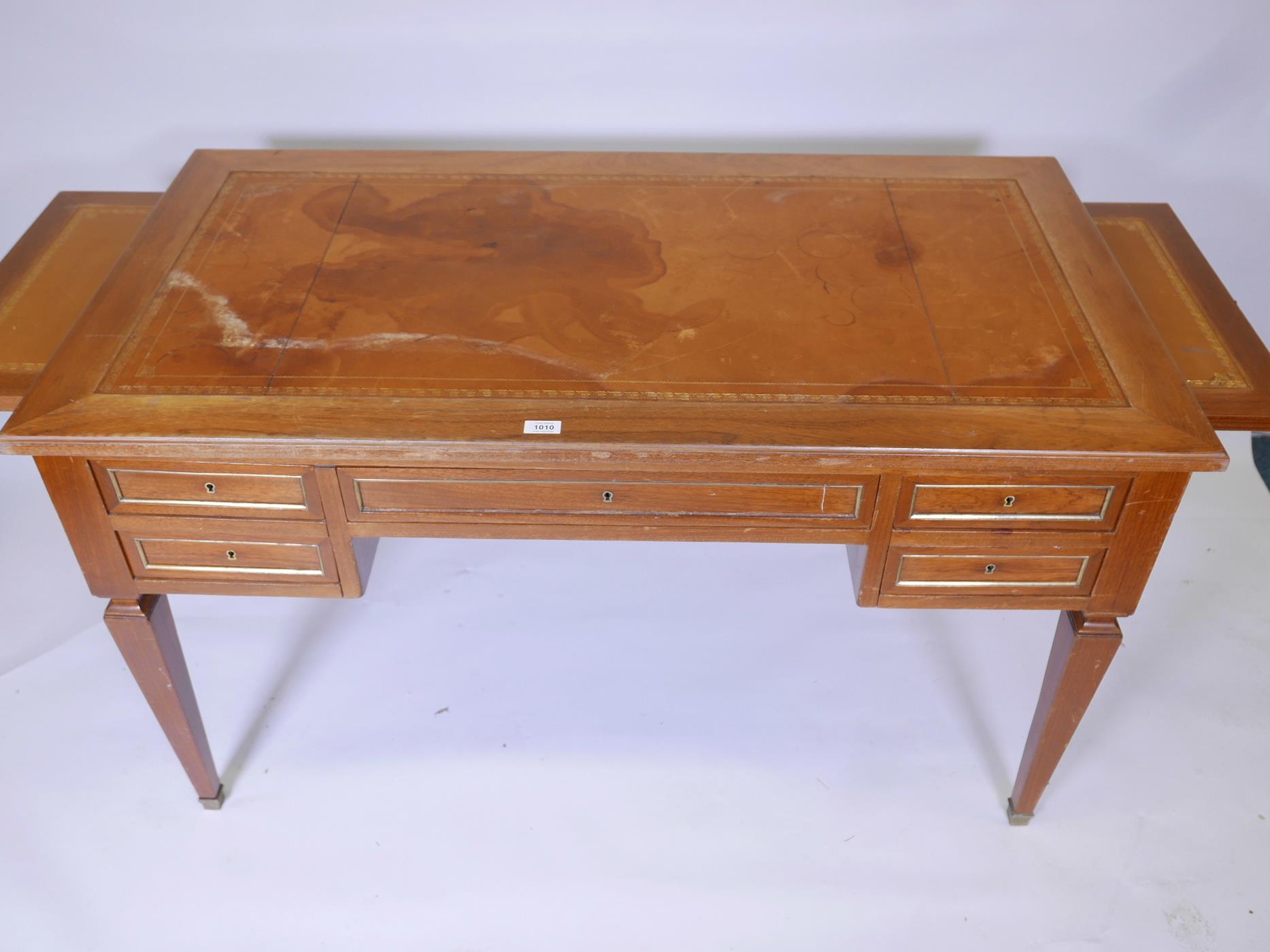A French mahogany five drawer desk, with brass mouldings, slides to each end, and inset leather top, - Image 2 of 3