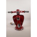 A painted metal lamp in the form of a Vespa, 12" high