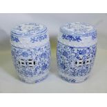 A pair of Chinese ceramic barrel seats, with blue and white decorative glaze, 18½" high x 11"