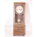 A vintage oak cased Air Ministry time clock, the dial painted The Gledhill-Brooke Time Recorder, 47"