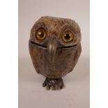 A cold painted bronze owl inkwell, with glass eyes and hinged head, in the style of Bergman,
