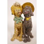 A cold painted bronze figurine of two dogs, in the style of Franz Bergman, 6" high