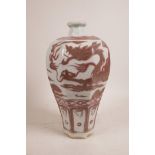 A Chinese hexagonal red and white pottery meiping vase with dragon decoration, 11" high