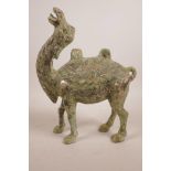 A Chinese mixed metal figure of a camel with archaic decoration and green verdigris patina, 12" high